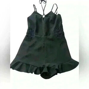 Black Romper Embroidered floral design , ruffle hem, zip up adjustable straps